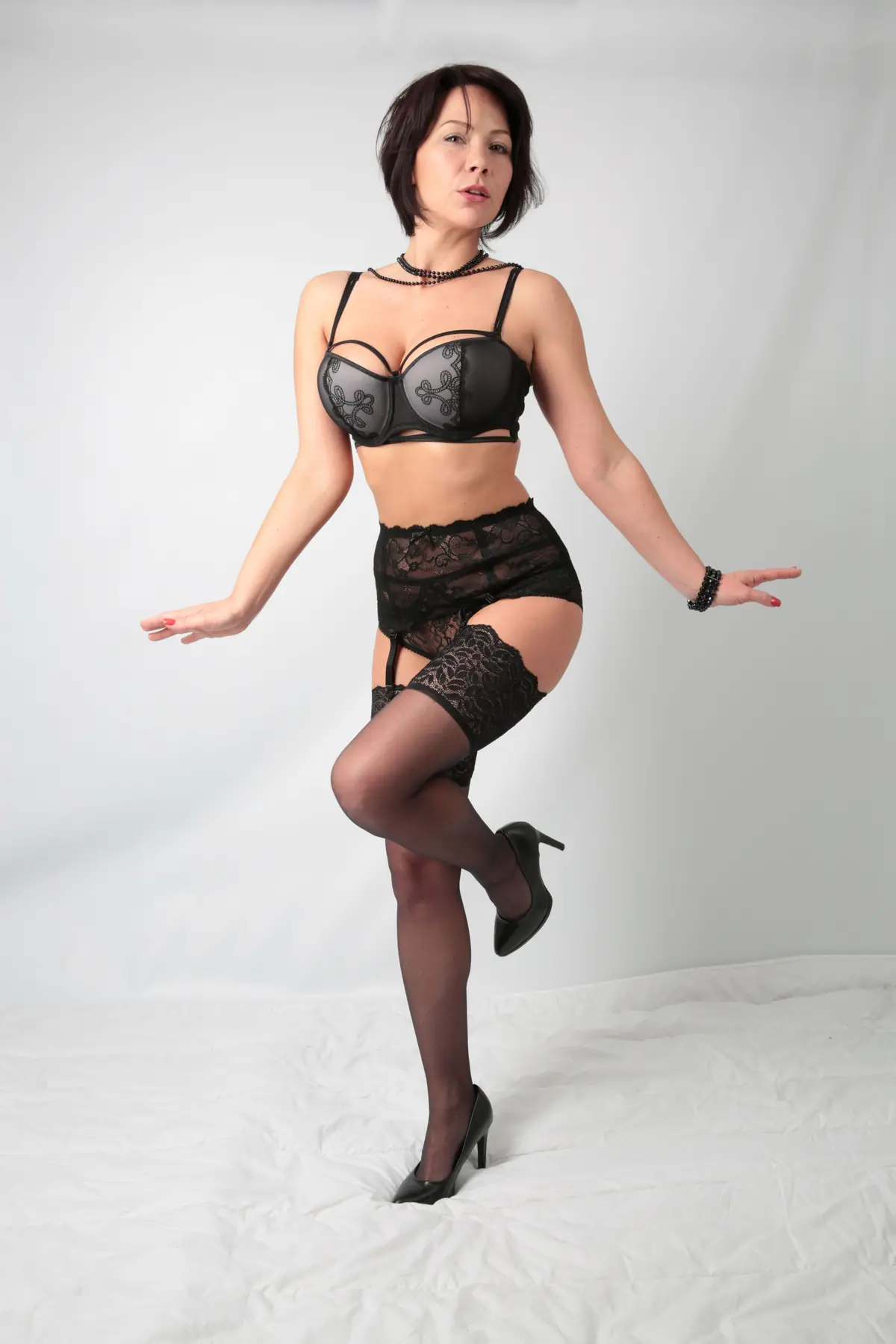 Illustrative stock photograph of a confident mature female model in a studio